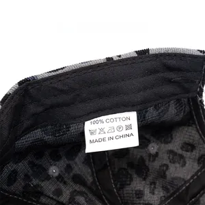 Care label showing 100% cotton material and made in China text on corduroy cap
