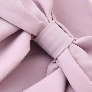 Pink sweet strapless dress featuring a backless design and waist bow detail