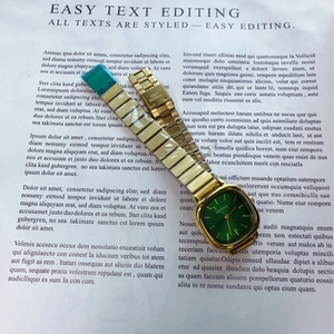 Detail of a ladies' gold stainless steel watch with a green rectangular dial and folding clasp