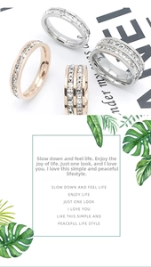 Detail of single and double row rhinestone rings in silver and rose gold finishes
