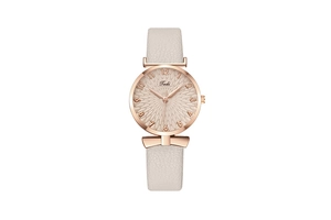 Detail of rose gold quartz watch with beige leather bow strap and textured dial