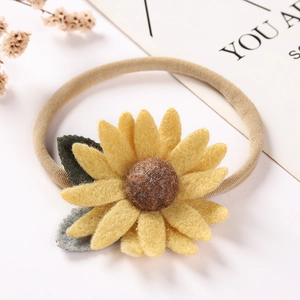 Bandeau bébé tournesol en nylon avec pétales en feutre jaune et ruban souple élastique