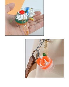 Miniature ice cream sundae keychain with red rose and orange details on bag
