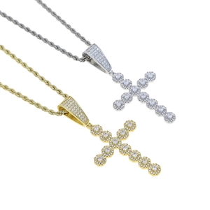 Close-up of gold and silver hip hop cross pendants with sparkling cubic zirconia stones