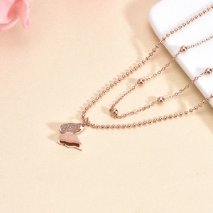 Elegant double-layered rose gold necklace with frosted butterfly pendant and bead chain