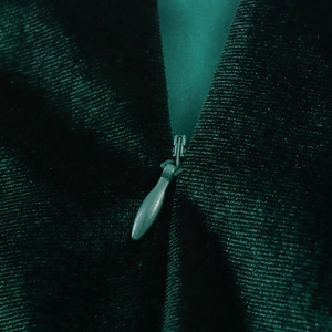 Elegant dark green velvet dress featuring a sophisticated invisible zipper on the back side