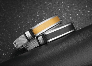 Close-up of Milanese mesh stainless steel bracelets with diamond-patterned metal plates