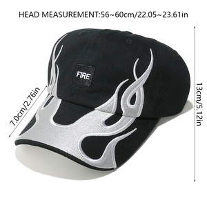 Detailed view of heavy embroidery flame patterns and FIRE patch on black baseball cap