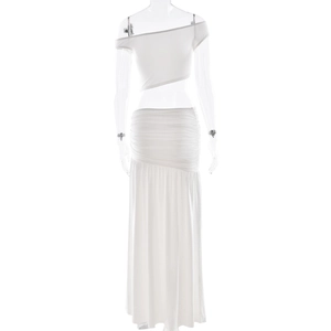 Detail of white two-piece set featuring asymmetrical tube top and pleated high-waisted skirt