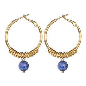 Detailed shot of 14k gold U-shape hoop earrings with blue stone beads and spiral accents