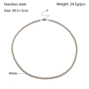 Detail of 4mm stainless steel ball chain necklace in gold and silver mixed finish