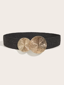 Close-up of black elastic woven belt with dual sunburst gold round metal buckles