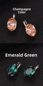 Close-up of oval zircon earrings in champagne and peacock green with silver hooks