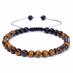 Close-up of adjustable bead bracelet with tiger eye stones and matte black onyx beads