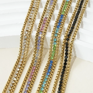 Chic gold box chain necklaces with colorful gemstone pendants on a modern white background