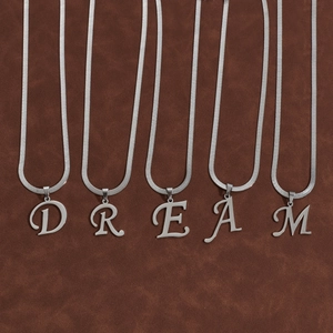 Silver stainless steel snake chain necklace with DREAM letter charms on brown leather