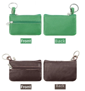 Detail of genuine leather coin pouches with pebble grain texture and dual zippers