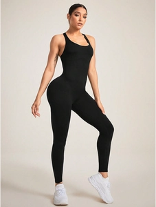Detail of a black sleeveless seamless yoga jumpsuit with racerback and high elasticity