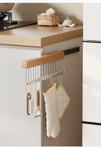 Close-up of the smooth sliding metal rails and wood texture on the pull-out wall rack