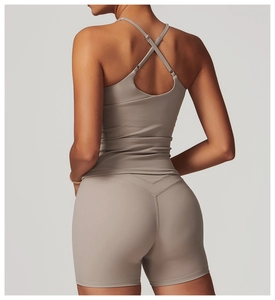 Detail of cross-back yoga vest and high-waist shorts in taupe with V-shape sewing