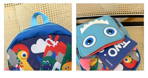 Detail of cartoon dinosaur schoolbag with matching monster coin purse for kids
