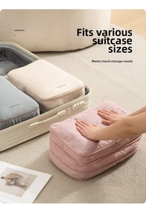 Grand organisateur de bagages taille L avec poignée sur fond de tapis clair