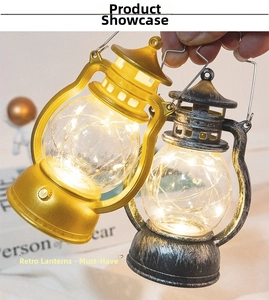 Close-up of vintage LED lanterns in gold and silver finish with warm glowing lights
