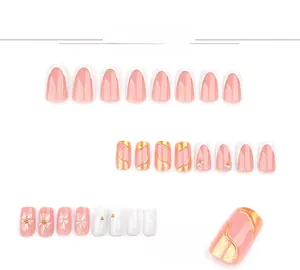 Detail of 3D white floral press on nails with French tips and pearl accents