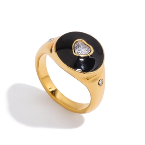 Detail of 18K gold stainless steel ring with black enamel heart and zircon stones