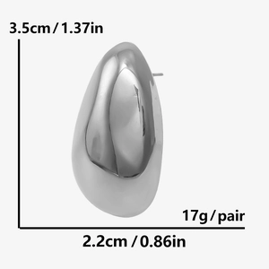 Detailed view of large teardrop earrings with dimensions 3.5cm by 2.2cm in silver finish