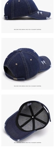 Detail of navy washed denim baseball cap with distressed brim and adjustable metal buckle
