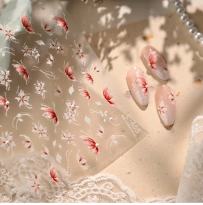 Detail of TL-455 nail stickers showing red and white flowers with butterfly and pearls