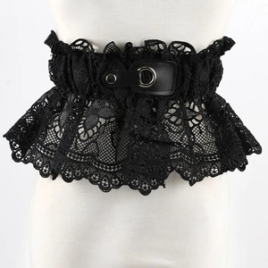 Detailed close-up of wide black floral lace waist belt with gothic silver ring buckle