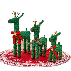 Three-piece sparkling green tinsel Christmas reindeer set with red bows and gold bells