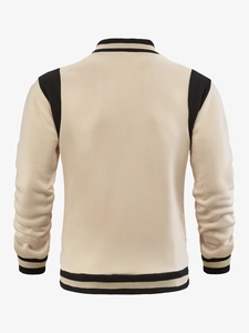 Back view of a retro varsity jacket in beige and black with striped ribbed cuffs and hem