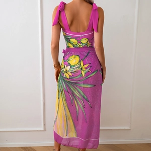 Detail of fuchsia chiffon wrap dress featuring lemon prints and shoulder ribbon bows