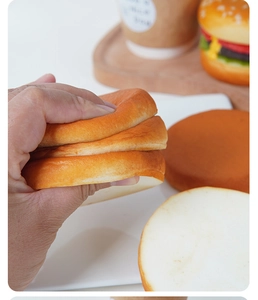 Close-up of soft slow-rebound squishy PU burger bun showing realistic texture and elasticity