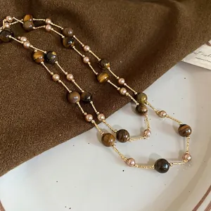 Vintage-Halskette mit Tigerauge-Stein, Perlen und eleganten goldfarbenen Ketten