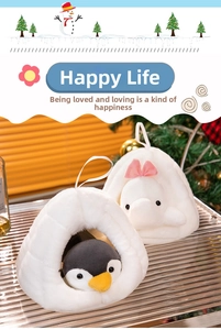 Close-up of plush penguin and rabbit dolls in cozy white nest winter holiday set