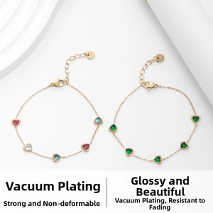 Detail of 18K gold plated chain bracelets featuring colorful heart-shaped cubic zirconia