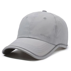 Close-up of breathable mesh holes and quick-dry fabric on the grey baseball cap