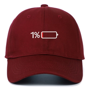 Close-up of 1% low battery embroidery on a burgundy cotton baseball cap detail