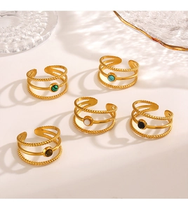 Detail of 18K gold stainless steel wrap rings with various colored natural stone inlays