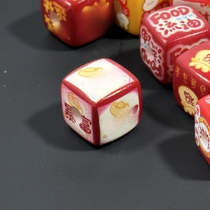 Macro view of square acrylic charms with auspicious Chinese text for lucky keychains