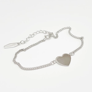 Minimalist 925 sterling silver heart charm link bracelet on white background