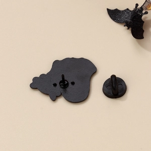 Detail of the black enamel pin back with durable metal butterfly clutch and rubber pin cap