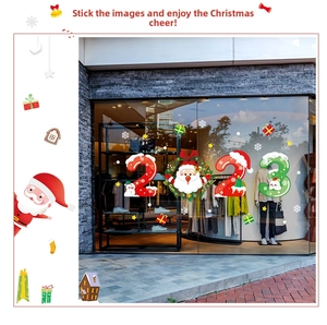 Detail of Christmas window stickers with Santa and 2023 number on shop glass