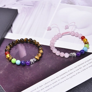 Tiger eye and rose quartz chakra beaded bracelets with silver elephant charm pendants
