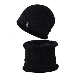 Close-up of black knit hat and neck warmer set with thick fleece lining texture