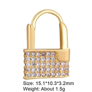Detailed view of a gold-plated heart lock pendant with micro-paved cubic zirconia accents